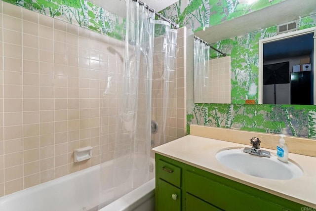 bathroom featuring shower / tub combo with curtain and vanity