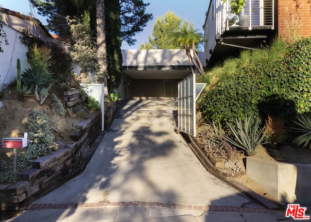 exterior space featuring a carport