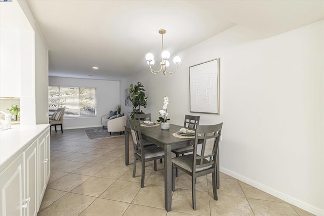 dining room featuring an inviting chandelier and light tile patterned floors