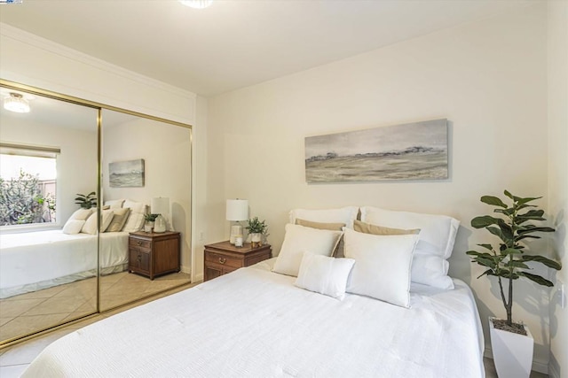 tiled bedroom featuring a closet