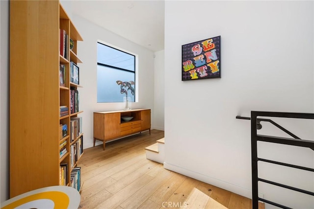 hall with light hardwood / wood-style flooring