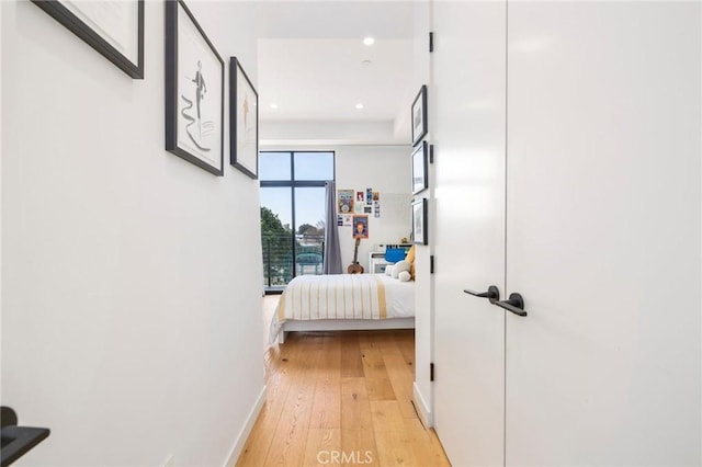 hall with light hardwood / wood-style flooring