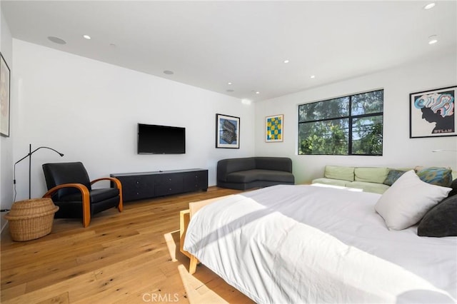 bedroom with hardwood / wood-style flooring