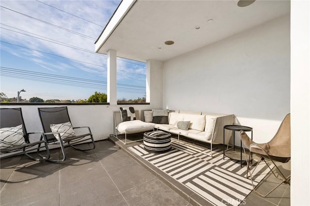 view of patio / terrace featuring an outdoor living space with a fire pit