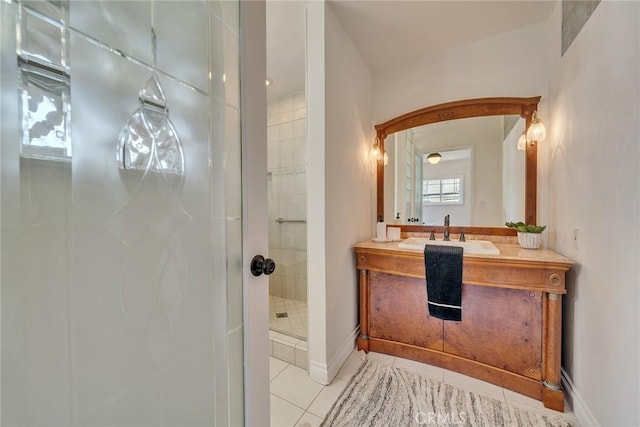 bathroom featuring tile patterned floors, vanity, and an enclosed shower