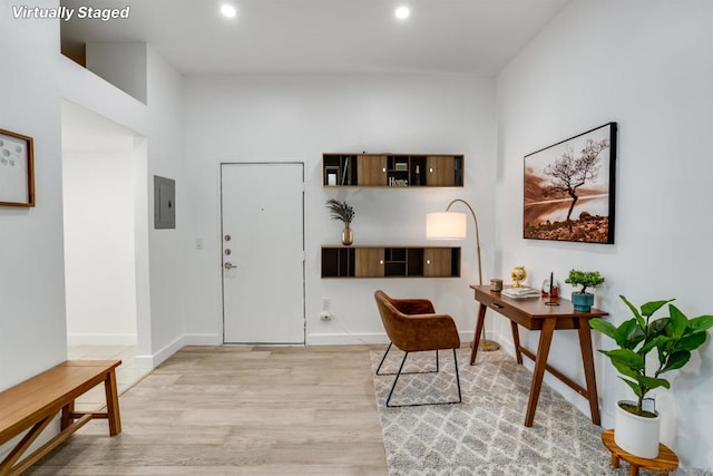 entrance foyer featuring electric panel and light wood-type flooring