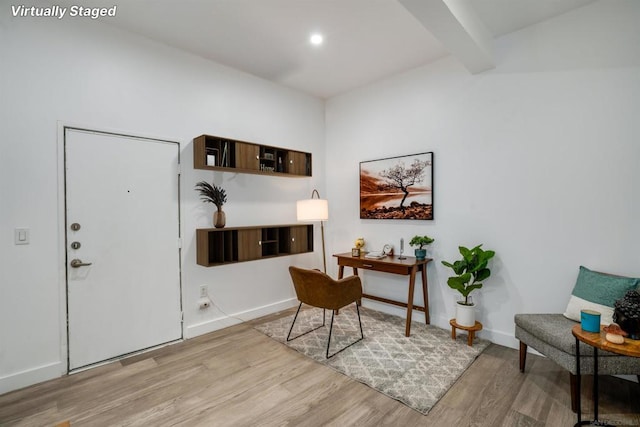 office area featuring beamed ceiling and light hardwood / wood-style floors