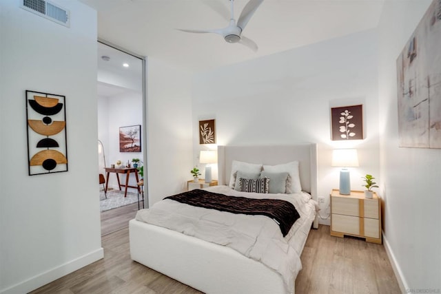 bedroom with ceiling fan and light wood-type flooring