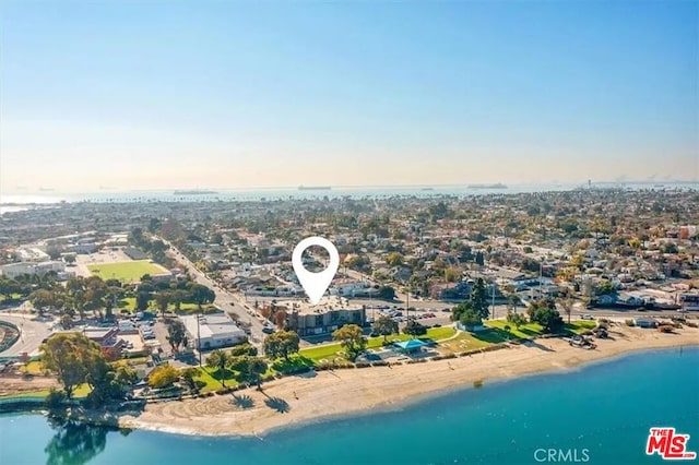 bird's eye view with a water view and a view of the beach