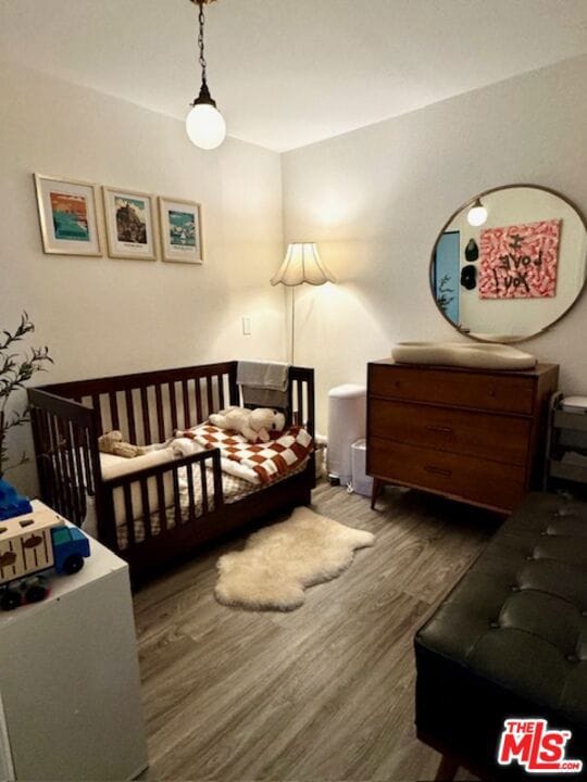 bedroom featuring dark wood-type flooring