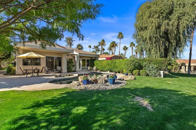 exterior space with a fenced in pool and a patio