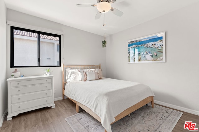 bedroom featuring ceiling fan and light hardwood / wood-style floors