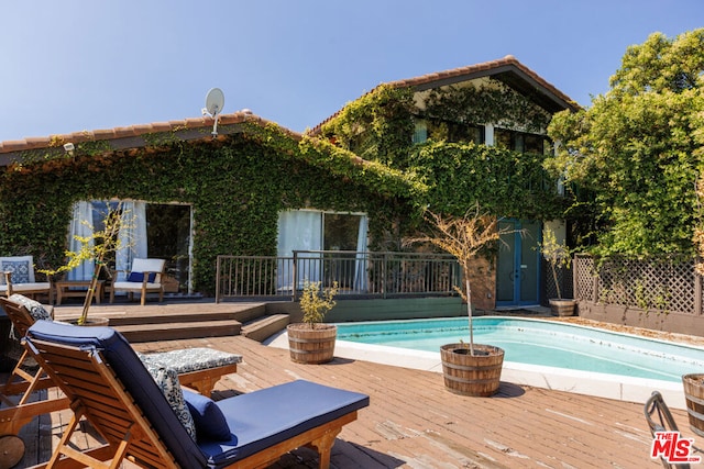 view of pool featuring a deck