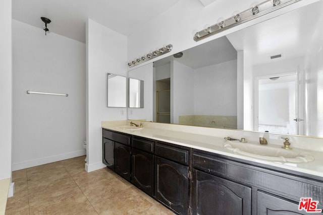 bathroom featuring vanity and tile patterned floors