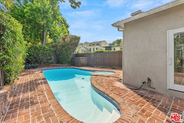 view of pool featuring a patio area