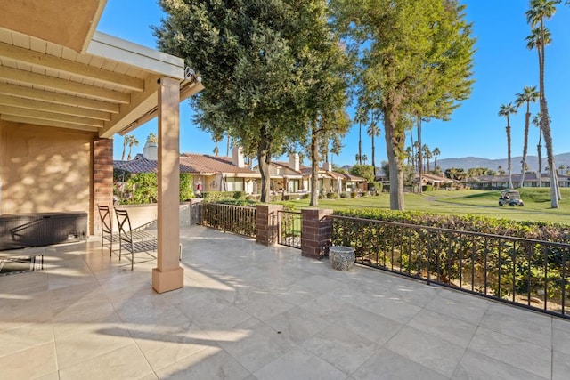 view of patio / terrace with a mountain view