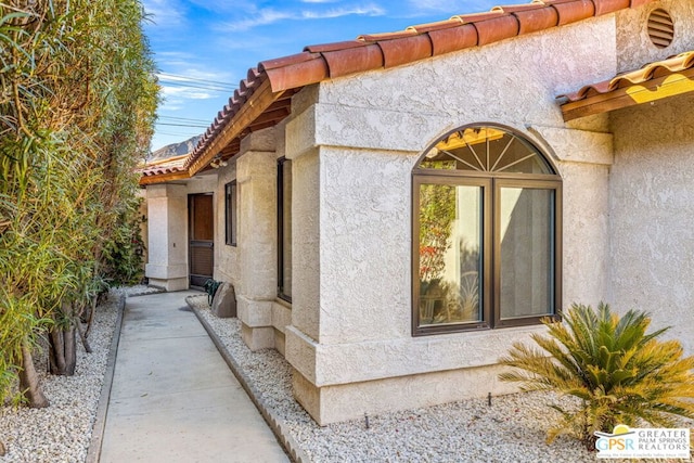 doorway to property featuring a patio area