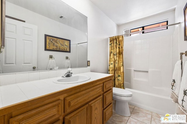 full bathroom with vanity, toilet, tile patterned flooring, and shower / bath combo