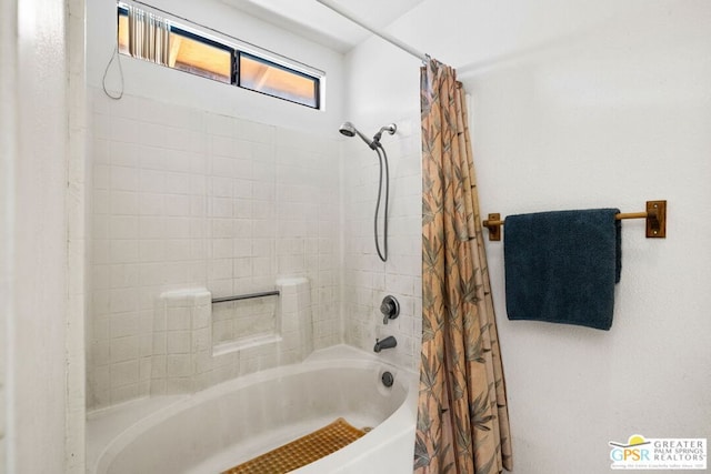 bathroom with shower / bath combination with curtain