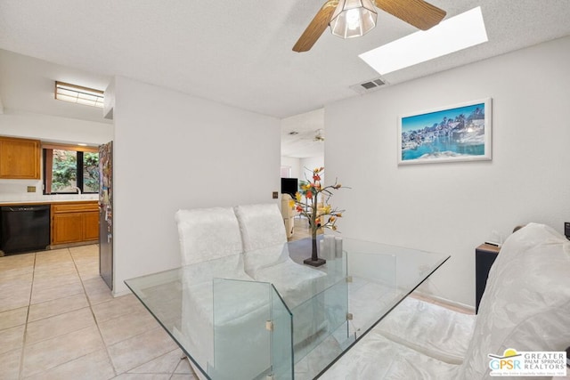 tiled dining space featuring ceiling fan