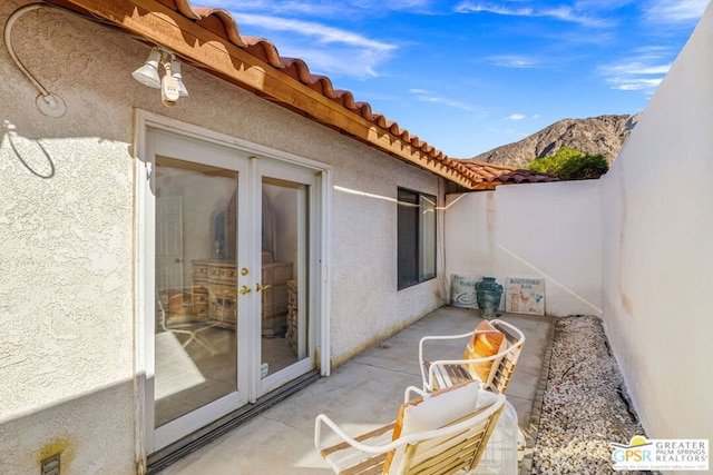 view of patio / terrace with a mountain view