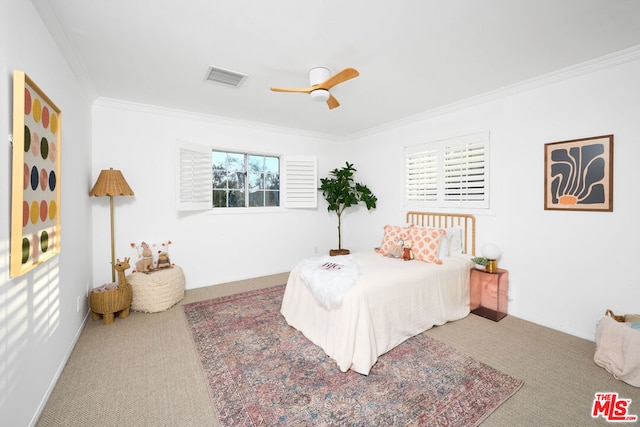 bedroom with crown molding, ceiling fan, and carpet flooring