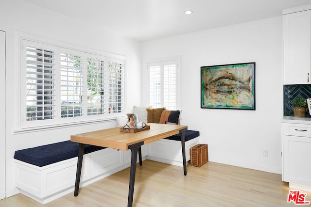 dining area with breakfast area and light wood-type flooring