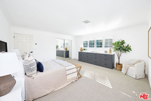 carpeted bedroom with ornamental molding