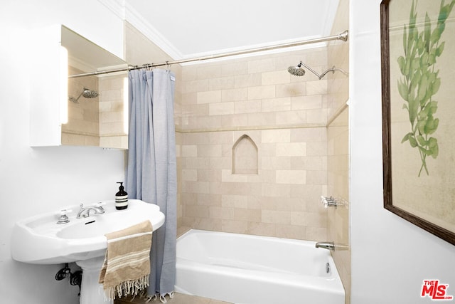 bathroom featuring ornamental molding and shower / tub combo with curtain