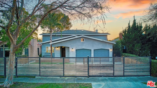 view of front of home with a garage