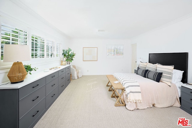 carpeted bedroom featuring ornamental molding and multiple windows