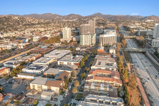 property's view of city with a mountain view