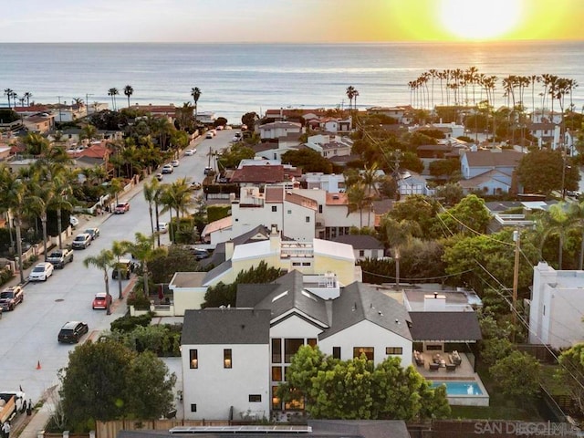 aerial view at dusk with a water view