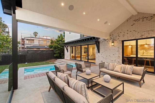 view of patio featuring an outdoor living space and a fenced in pool