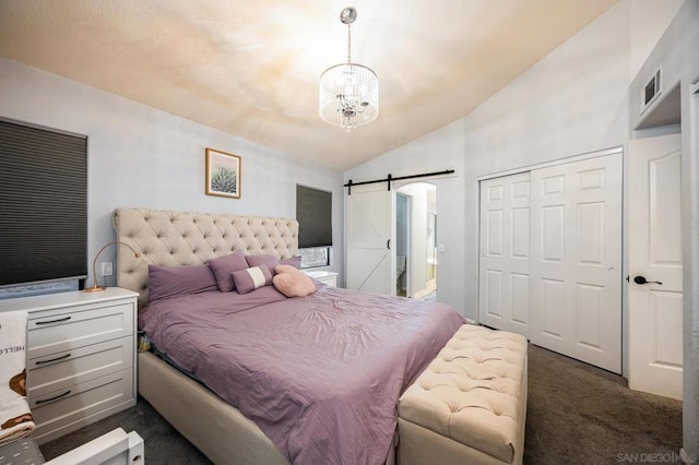 bedroom with vaulted ceiling, dark carpet, a closet, a notable chandelier, and a barn door