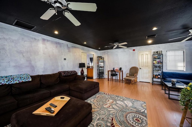 living room featuring hardwood / wood-style flooring and ceiling fan