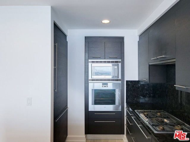 kitchen featuring backsplash and appliances with stainless steel finishes