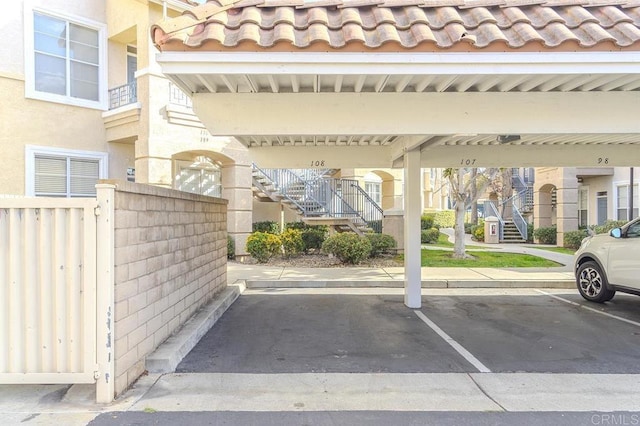 view of vehicle parking featuring a carport