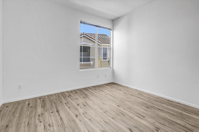 spare room featuring light wood-type flooring