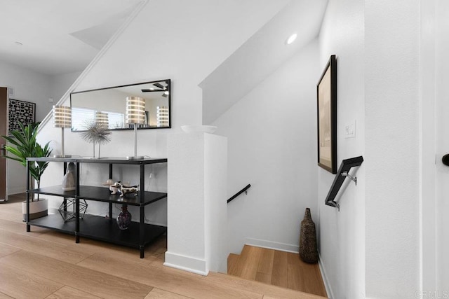 staircase with hardwood / wood-style flooring