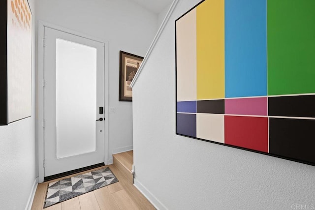 doorway to outside with light hardwood / wood-style floors