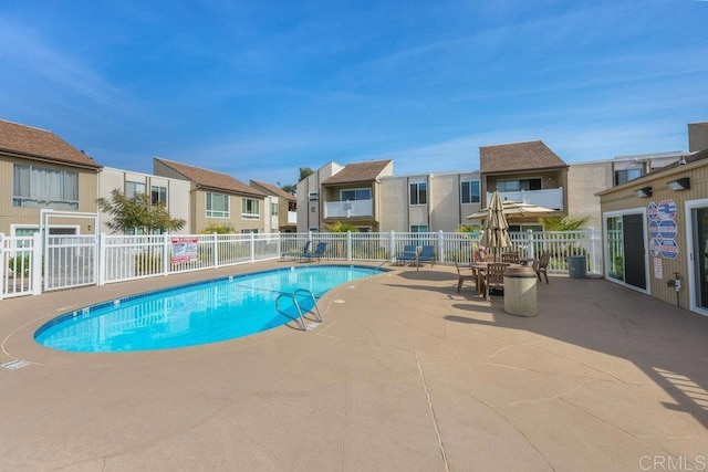 view of swimming pool featuring a patio