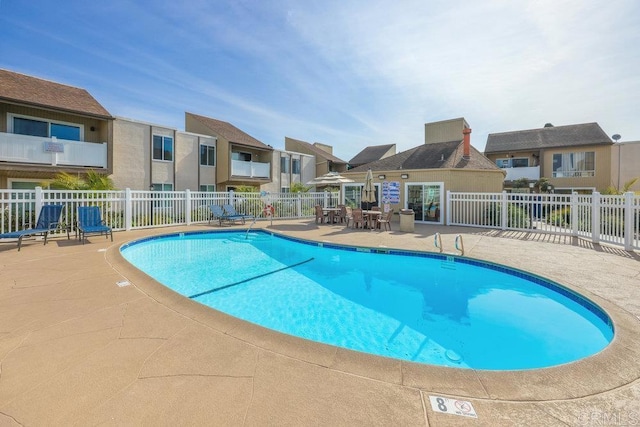 view of swimming pool featuring a patio