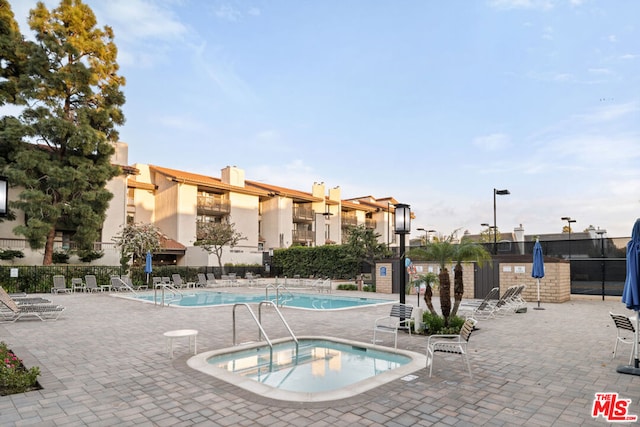 view of pool featuring a patio