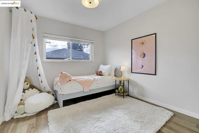 bedroom featuring hardwood / wood-style flooring