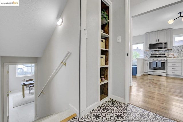 stairs with hardwood / wood-style floors