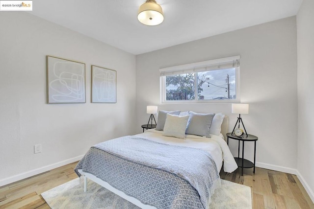 bedroom with wood-type flooring