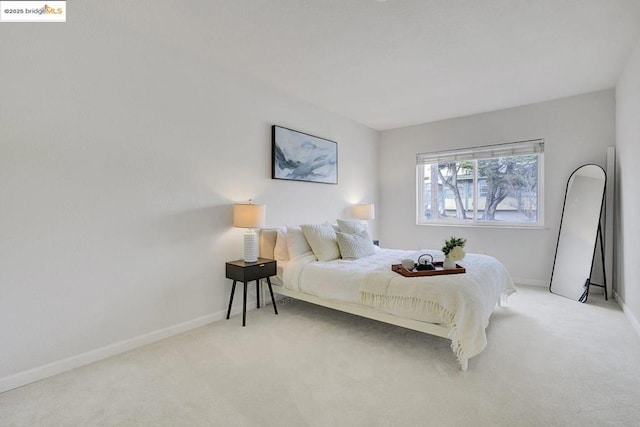 bedroom with light colored carpet