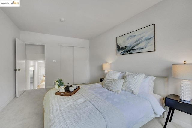 carpeted bedroom with a closet