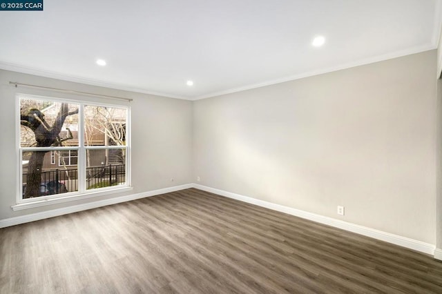 unfurnished room featuring crown molding and dark hardwood / wood-style floors